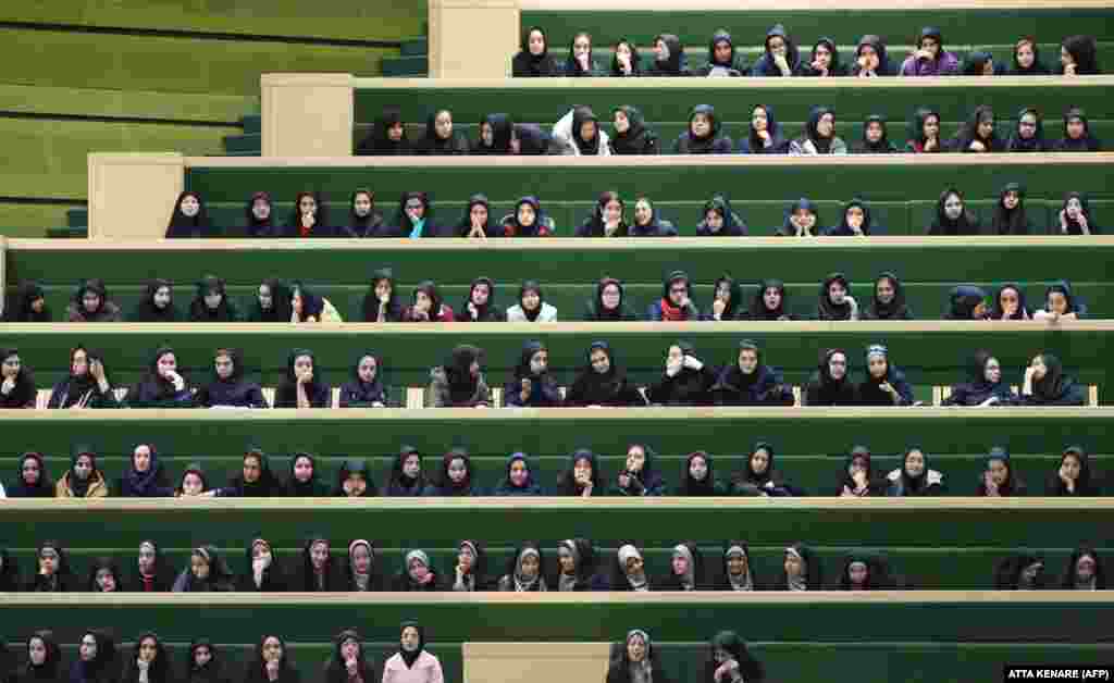 Iranian school girls listen to a speech by President Mahmud Ahmadinejad at a parliamentary session in Tehran on February 3.