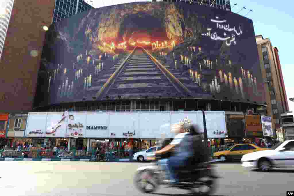 A banner honoring dozens of people who were killed in a coal mine explosion in eastern Iran is erected over a street in the country&#39;s capital, Tehran&nbsp;