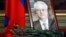 Flowers are laid in front of a portrait of Russian Ambassador to the United Nations Vitaly Churkin at the Foreign Ministry guest house in Moscow on February 21. Churkin died suddenly the previous day. 