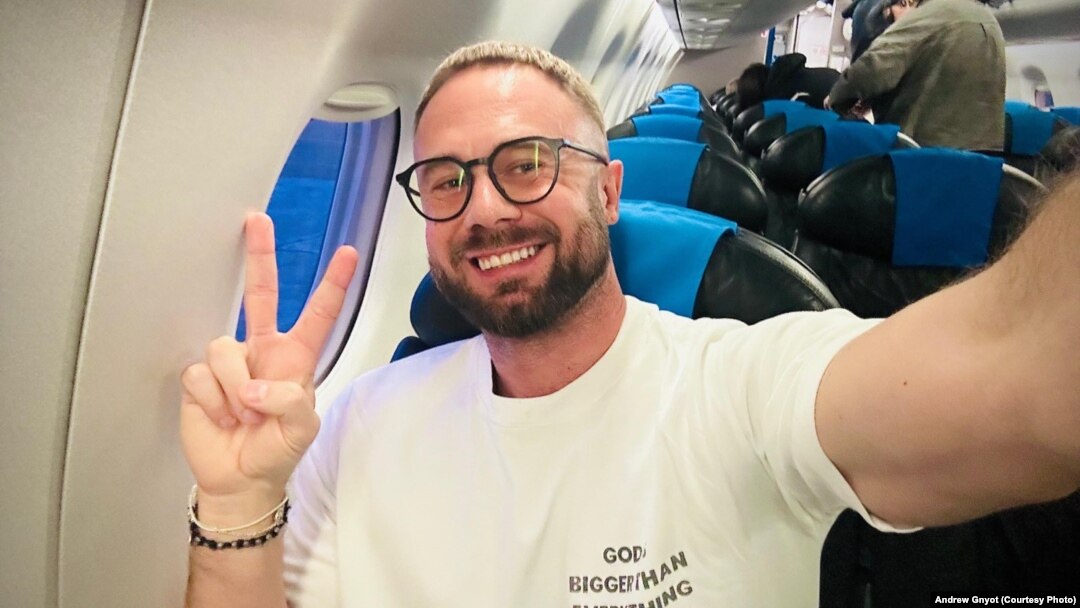 Belarusian activist Andrey Hnyot celebrates during his flight out of Serbia on October 31.