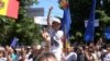 Moldova - pro-European Union supporters cheer in front of parliament in Chisinau when lawmakers approved Moldova’s Association Agreements with the EU. roundup screen grab, 2 July 2014.