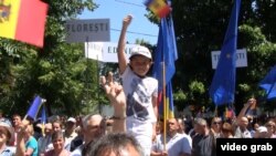 Moldova - pro-European Union supporters cheer in front of parliament in Chisinau when lawmakers approved Moldova’s Association Agreements with the EU. roundup screen grab, 2 July 2014.