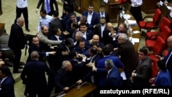 Armenia - Opposition and pro-government deputies brawl in the Armenian parliament, Yerevan, October 29, 2026. 
