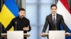 Ukrainian President Volodymyr Zelenskyy (left) speaks to reporters alongside Dutch Prime Minister Rob Jetten in The Hague on October 28. 