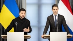 Ukrainian President Volodymyr Zelenskyy (left) speaks to reporters alongside Dutch Prime Minister Rob Jetten in The Hague on October 28. 