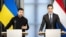 Ukrainian President Volodymyr Zelenskyy (left) speaks to reporters alongside Dutch Prime Minister Rob Jetten in The Hague on October 28. 
