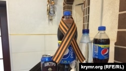 Ukraine, Crimea - Pepsi with St. George ribbon in a cafe