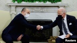 U.S. President Joe Biden (right) shakes hands with Naftali Bennett, Israel's prime minister at the time, at the White House in August 2021. 