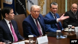 US President Donald Trump attends a a cabinet meeting on August 26 with Secretary of State Marco Rubio (left) and Defense Secretary Pete Hegseth (right). 