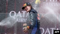 Никола Цолов ликува след победата си в първото състезание от новия сезон на Формула 2 на пистата "Албърт Парк" в Мелбърн, Австралия, 8 март 2026 г.