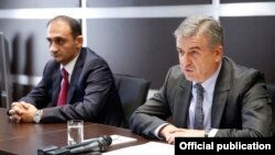 Armenia - Prime Minister Karen Karapetian (R) introduces the new head of the State Revenue Committee, Vartan Harutiunian, to senior SRC officials in Yerevan, 11Oct2016.