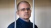 Paul Whelan stands in the defendant's cage while waiting for a hearing in a courtroom in Moscow in August 2019.