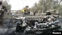 The remains of a vehicle used in the bomb attack outside Baghdad's Green Zone on April 18