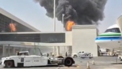 Smoke and flames rise from King Khalid Airport, after Yemen's Iran-backed Houthis said they attacked the airport, in Riyadh, Saudi Arabia.
