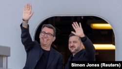 British Prime Minister Andy Burnham gestures with Ukrainian President Volodymyr Zelenskyy, during their visit to Portsmouth Naval Base to meet UK and Ukrainian troops on July 27, 2026.