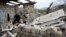 Nagorno-Karabakh -- A man walks through the ruins of his house in the village of Talish, some 80km north of Karabakh's capital Stepanakert, April 6, 2016