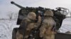 Ukrainian service members hold drills in the Kherson region on January 28 amid intensifying tensions on their country's border with Russia
