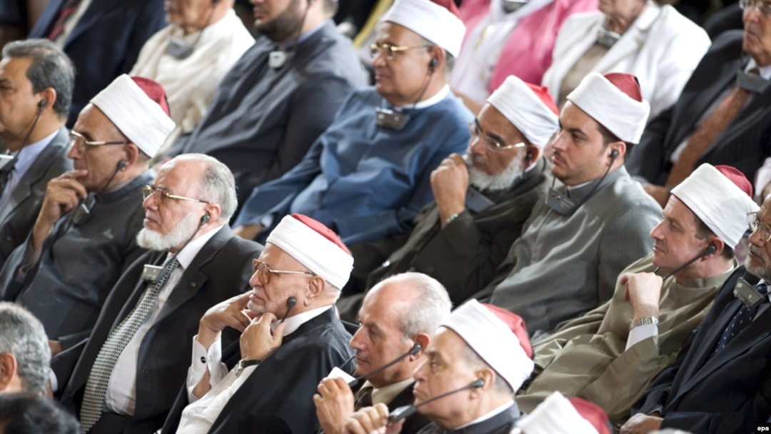 Audience members listen to a translation through headphones as U.S. President Barack Obama speaks at Cairo University on June 4.