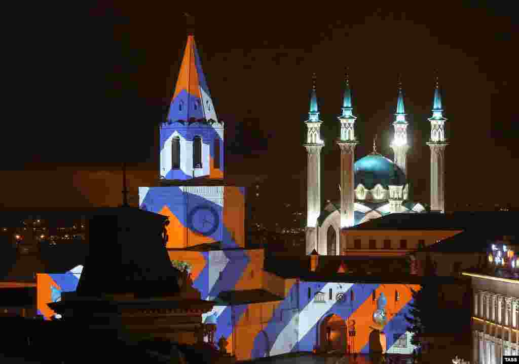 Projection mapping is shown on the Spasskaya Tower of the Kazan Kremlin. (TASS/Yegor Aleyev)