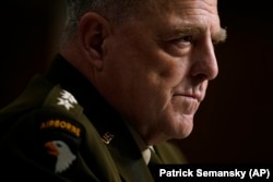 Chairman of the Joint Chiefs of Staff General Mark Milley listens to a senator's question during a Senate Armed Services Committee hearing on the conclusion of military operations in Afghanistan and plans for future counterterrorism operations on September 28.