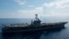 AT SEA -- An MH-60R Sea Hawk piloted by Cmdr. Paul D. Will (top), breakes formation during an aerial change of command ceremony above USS John C. Stennis (CVN 74) in the South China Sea, May 20, 2016