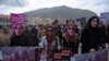 Afghan activists march before artists performed a play depicting the 2015 lynching of Afghan woman Farkhunda Malikzada in Kabul on March 17, 2016.