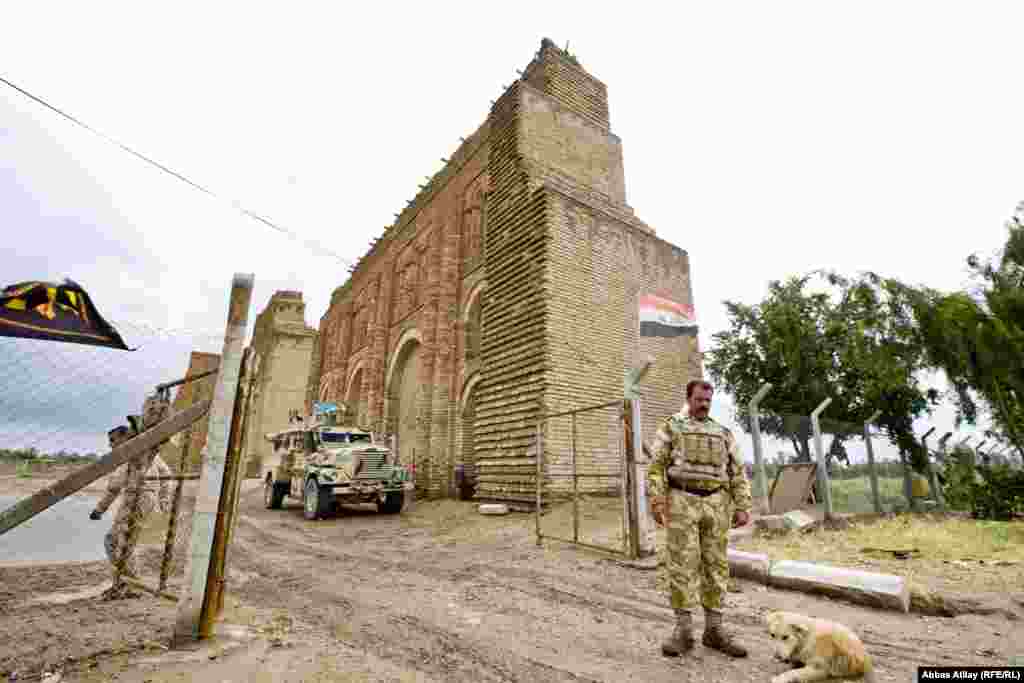Military units guard a historic building at the Al-Madain.