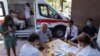 ARMENIA -- People prepare to get vaccinated against the coronavirus disease (COVID-19) at a mobile vaccination center in Yerevan, July 19, 2021