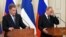 Russian President Vladimir Putin (right) attends a news conference with Finnish President Sauli Niinisto outside of Moscow on June 16.