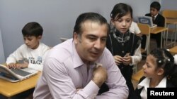 Georgian President Mikheil Saakashvili visits first-graders during their first lesson at the start of the new school year in September.