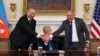 U.S. President Donald Trump holds the hands of Azerbaijan's President Ilham Aliyev and Armenia's Prime Minister Nikol Pashinyan during a trilateral signing event at the White House, Washington, August 8, 2025.