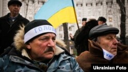 Ukrainian Chornobyl veterans rally in Kyiv near the government headquarters on December 1.