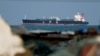 An LPG gas tanker sits at anchor as traffic is down in the Strait of Hormuz in Shinas, Oman, on March 11.