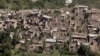 FILE: A photograph taken from a Pakistani army helicopter shows empty houses whose roofs have been removed by the army during a military operation are seen in the South Waziristan tribal district.