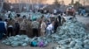 Local residents and volunteers prepare sandbags to strengthen flood defenses in Ishim in Russia's Tyumen region on April 21. 