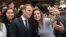 French President Emmanuel Macron poses for selfies with students at Paris-Sorbonne University Abu Dhabi on November 9.