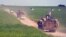 A convoy of U.S. troops and the People's Protection Units (YPG) Kurdish militia patrol near Syrian-Turkish border in 2017.
