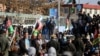 Supporters of presidential contender Abdullah Abdullah rally in Kabul on November 29.