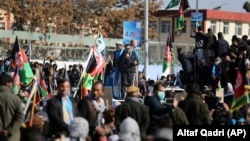 Supporters of presidential contender Abdullah Abdullah rally in Kabul on November 29.