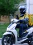 Moldova, An Asian worker employed by a delivery company on the streets of Chisinau