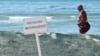  'No Swimming' sign is pictured on a beach in the Black Sea resort town of Anapa.