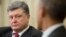 Ukrainian President Petro Poroshenko (left) listens as President Barack Obama talks during their bilateral meeting in the Oval Office of the White House in Washington on September 18.