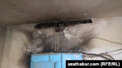 Turkmenistan. burned electricity cables and black smoke on the wall