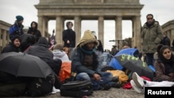 FILE: Afghan refugees protest in front of Brandenburg Gate in Berlin in 2012.