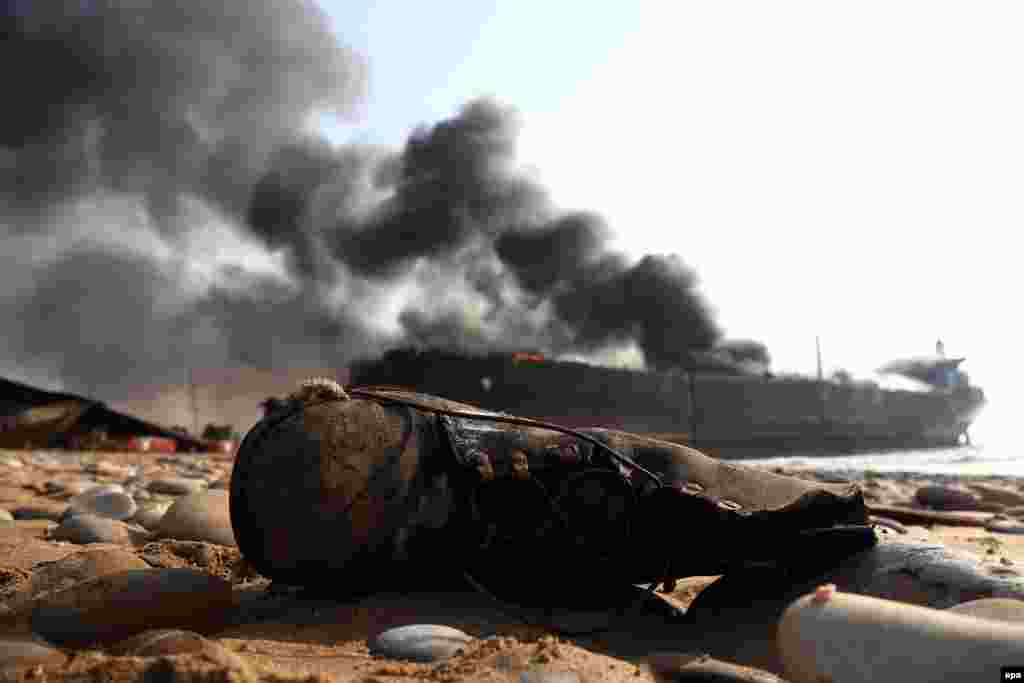 Smoke rises after an explosion at the Gadani ship-breaking yard in Pakistan on November 1. (epa/Rehan Khan)