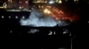 O captură dintr-o înregistrare furnizată de Rudaw TV arată fumul care se ridică dintr-o clădire lovită de un atac în Irbil, Irak, 16 ianuarie 2024.