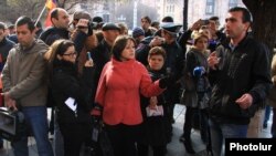 Armenia - Activist Vaghinak Shushanian (R) speaks at an anti-government protest in Yerevan, 19Dec2014.