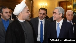 Iran - Newly elected President Hassan Rohani (L) meets with his visiting Armenian counterpart Serzh Sarkisian in Tehran, 5Aug2013.