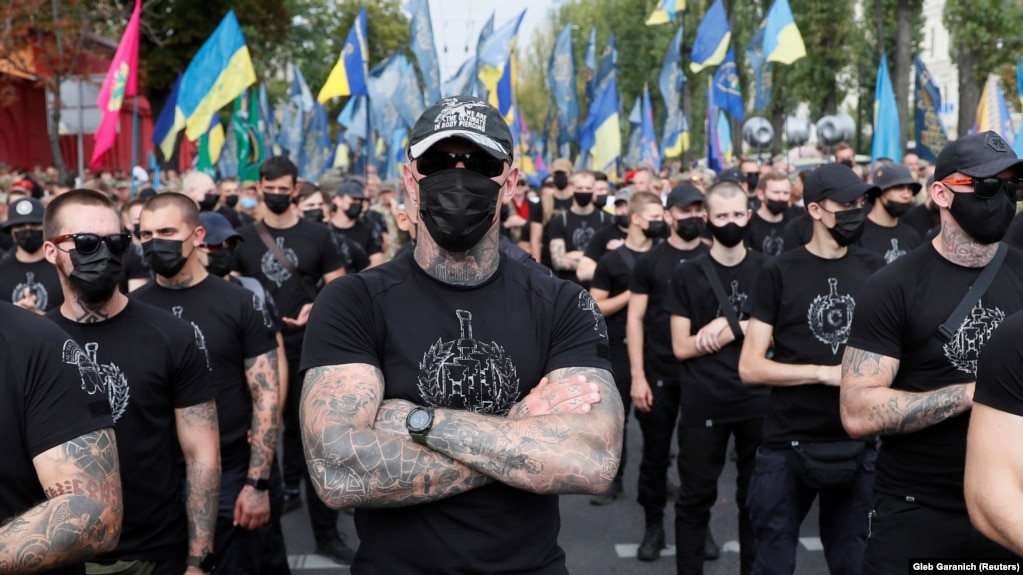 Veterans of the Azov Battalion and activists and supporters of the Azov civil corps march on Ukraine's Independence Day in Kyiv on August 24. A leader of the group welcomed the U.S. unrest in openly racist terms.