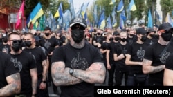 Veterans of the Azov Battalion and activists and supporters of the Azov civil corps march on Ukraine's Independence Day in Kyiv on August 24. A leader of the group welcomed the U.S. unrest in openly racist terms.